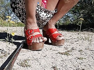 Walking in public dressed as a woman in high heels and hot thong