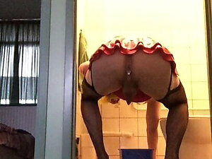 Cleaing the toilet bowl (back side view)