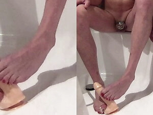 Tgirl vibrated, squirts and gives a footjob